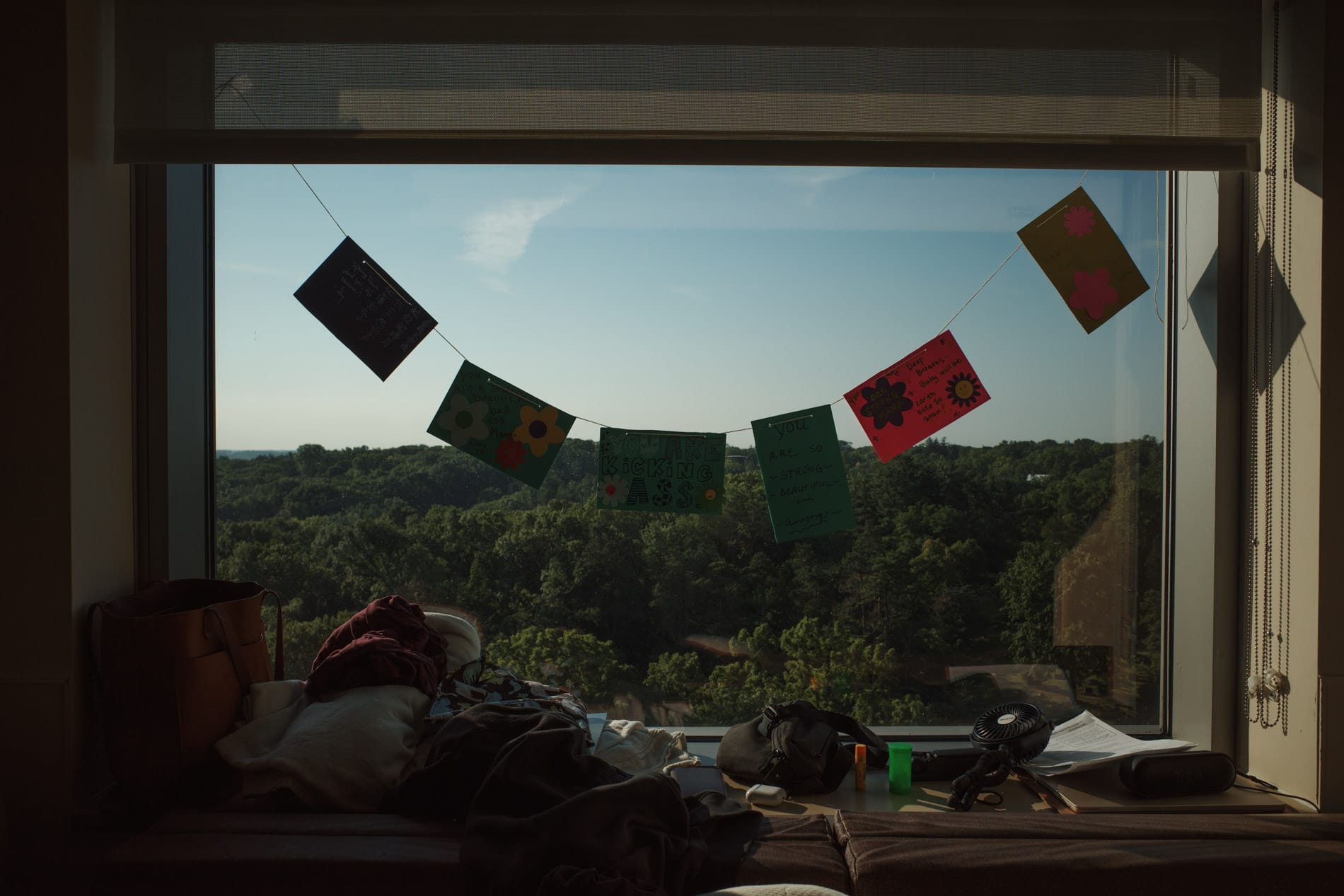 Belly blessing banners strung up over big picture window