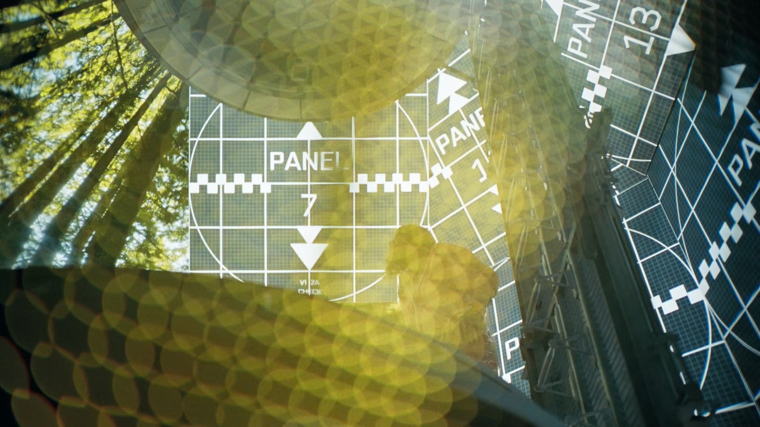 Low-angle forest canopy overlaid with translucent calibration panels labeled Panel 7 and Panel 13, a suited figure at the center, and dense golden prismatic bokeh across the frame.